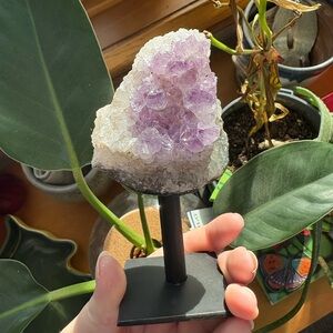 Amethyst crystal geode on stand